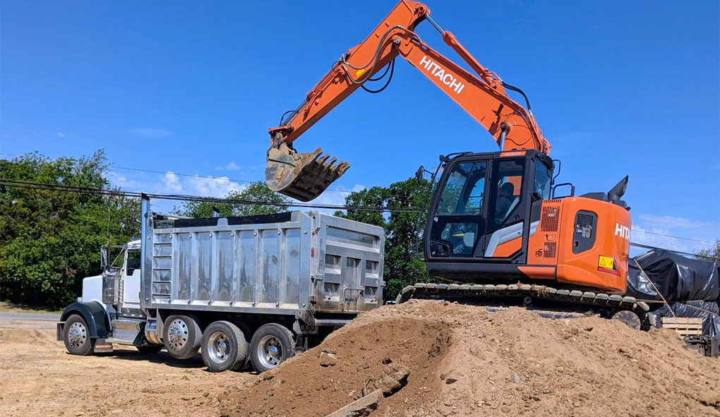 Construction dumpster rental container at a job site in Lexington Park, MD.