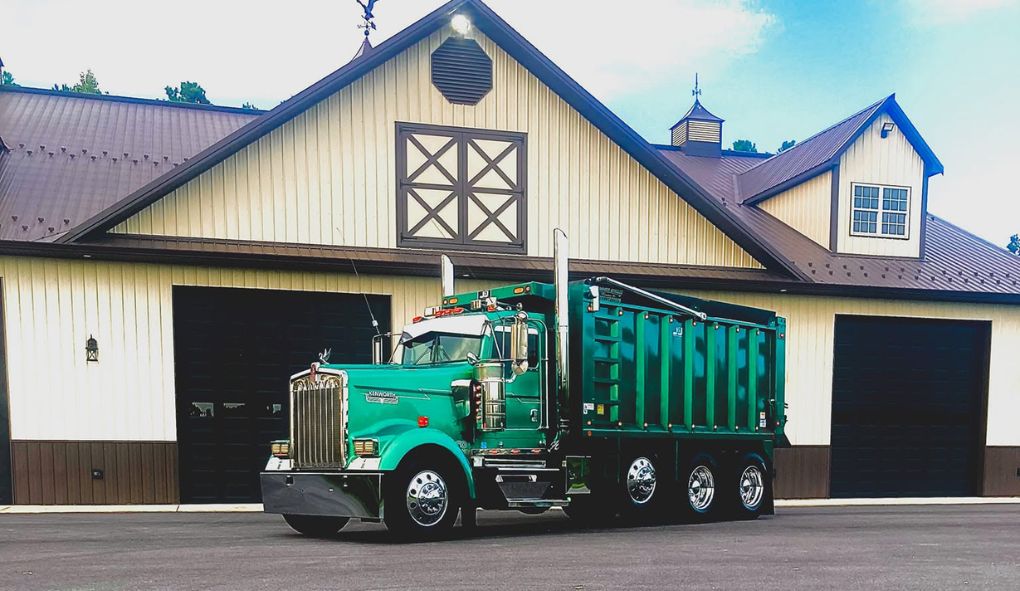 Roll-off dumpster truck for home cleanout in Southern Maryland