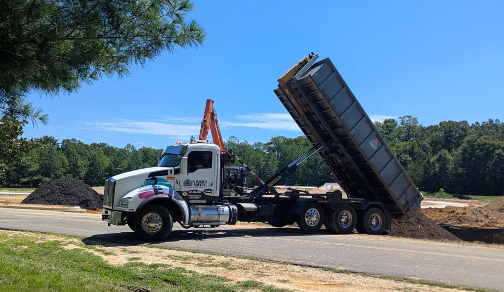 Site services in Southern Maryland with dump truck and excavation work